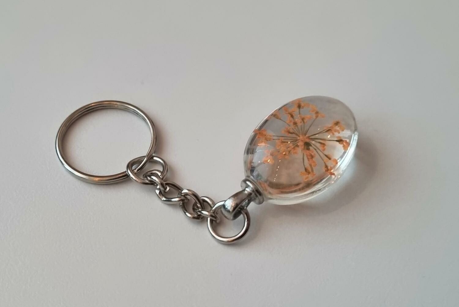 Nyckelring med oval glasberlock (orange)