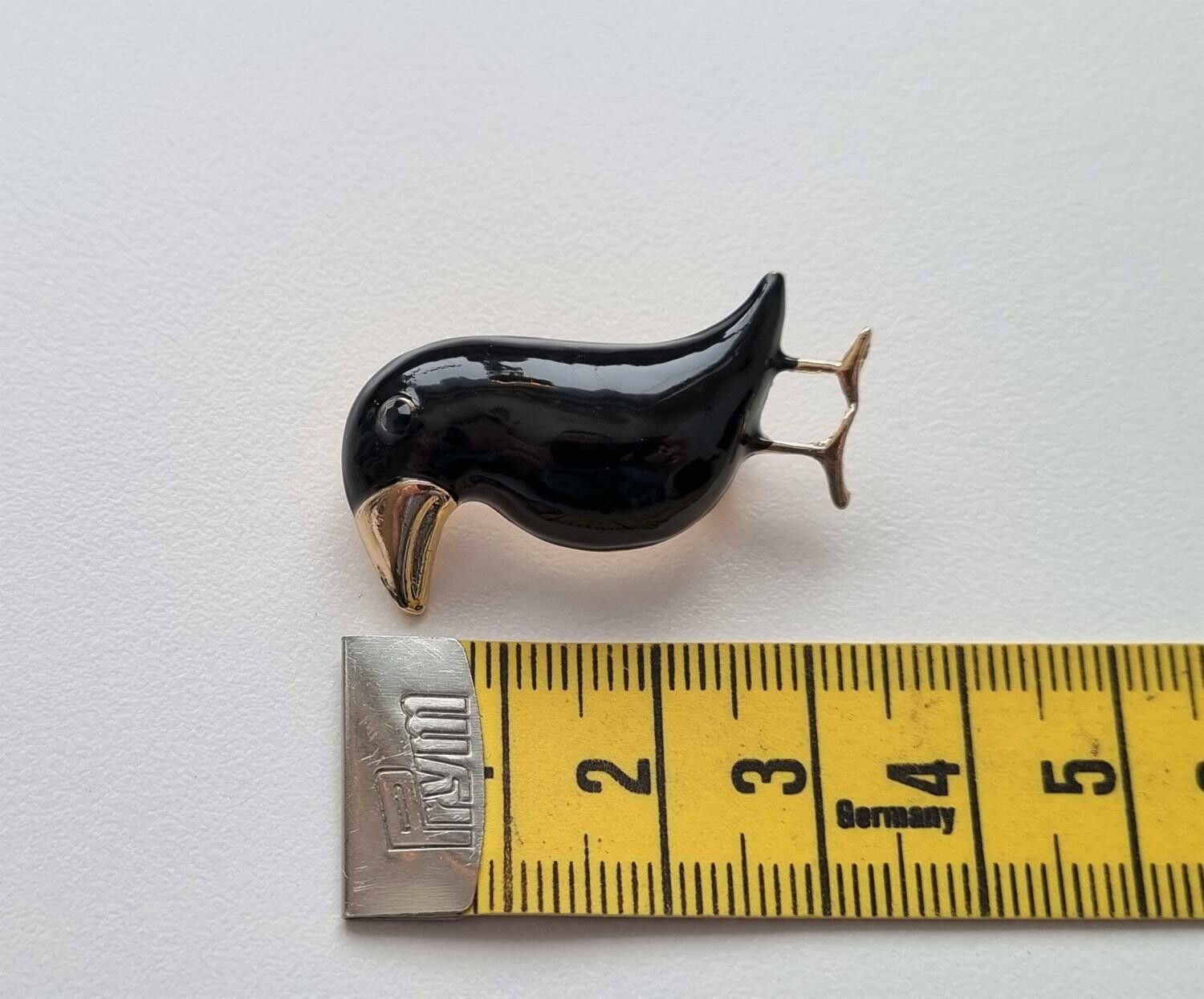 Brosch, söt liten svart fågel