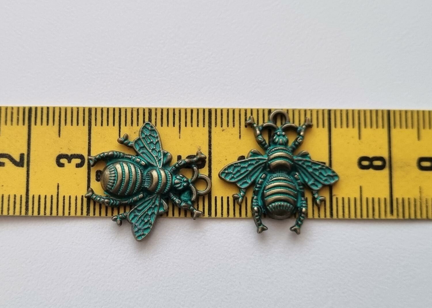 2 st berlocker Charms - Bin