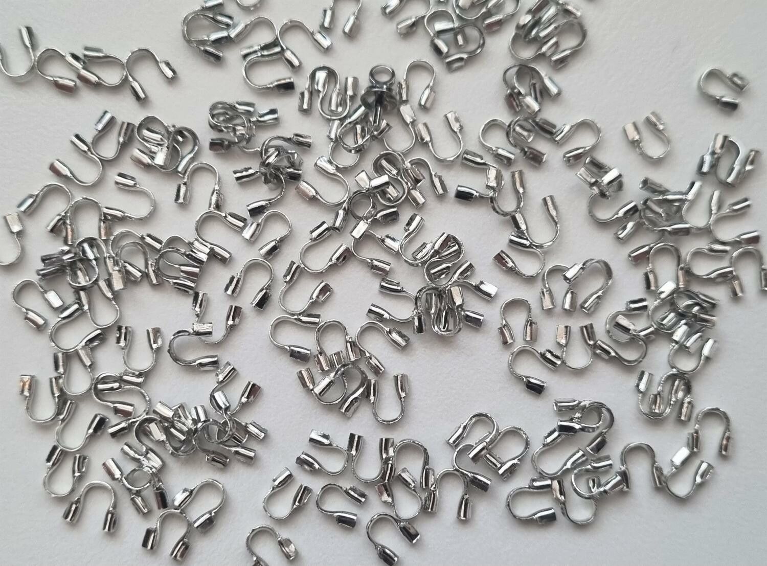 50 st silverfärgade Wire guards, smyckestillbehör