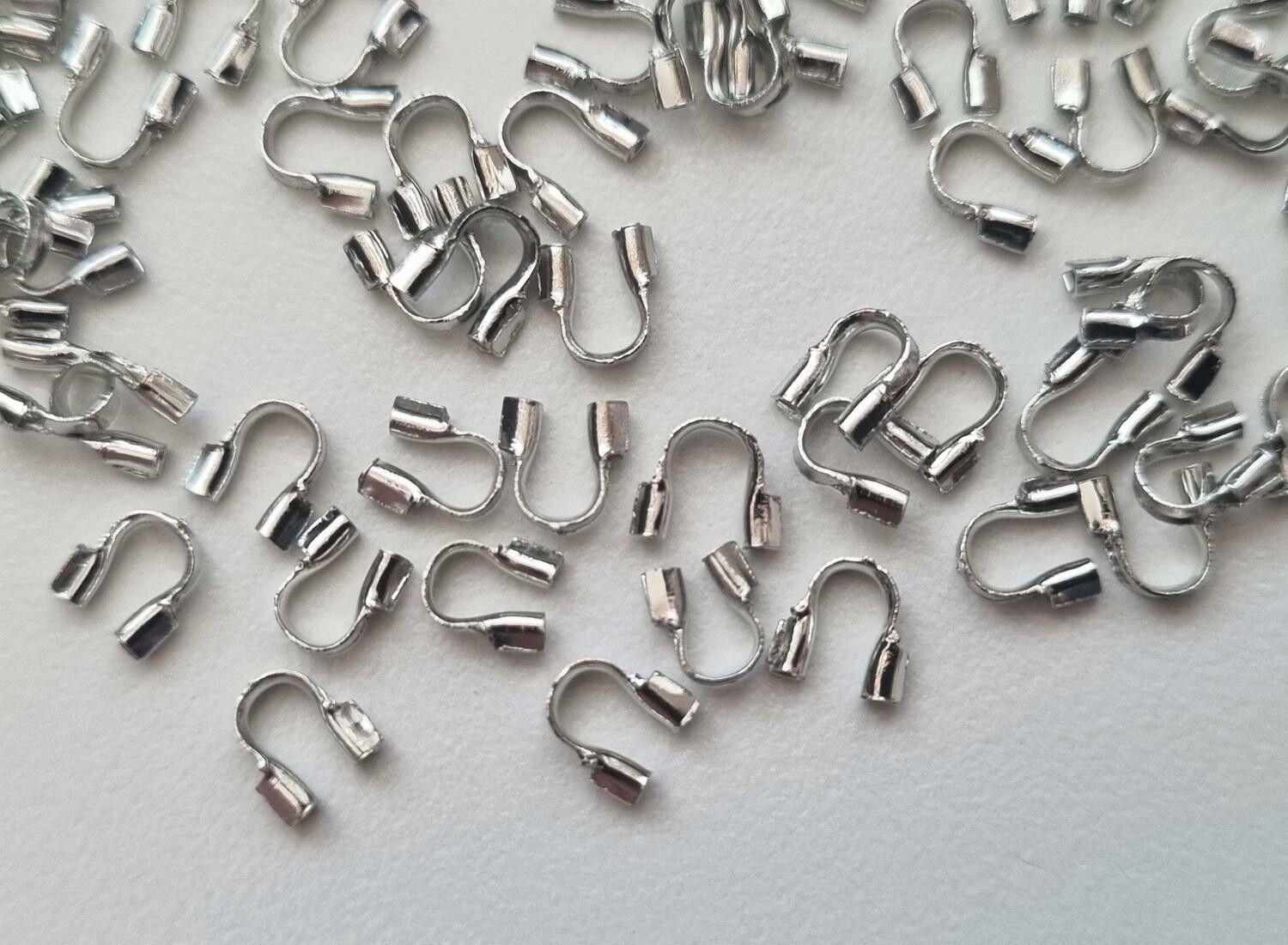 50 st silverfärgade Wire guards, smyckestillbehör