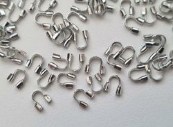 50 st silverfärgade Wire guards, smyckestillbehör