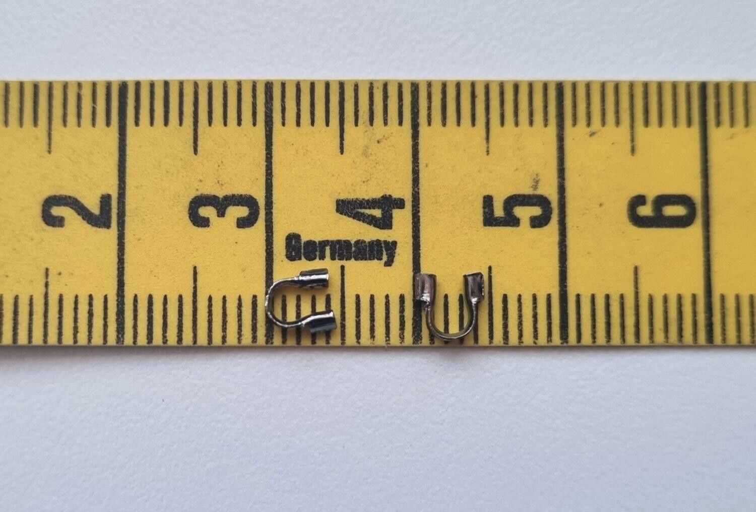 50 st svarta Wire guards, smyckestillbehör