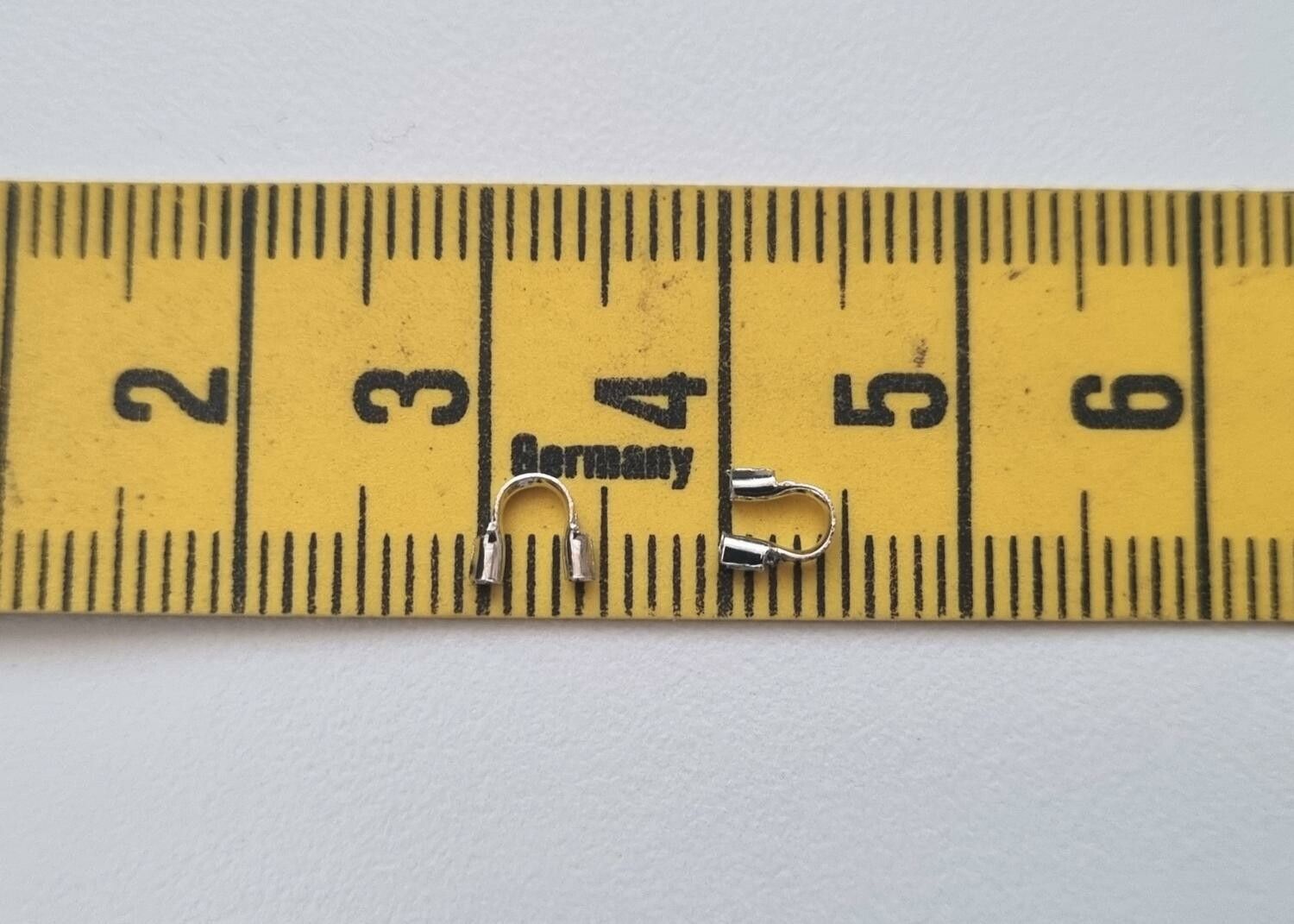 50 st silverfärgade Wire guards, smyckestillbehör