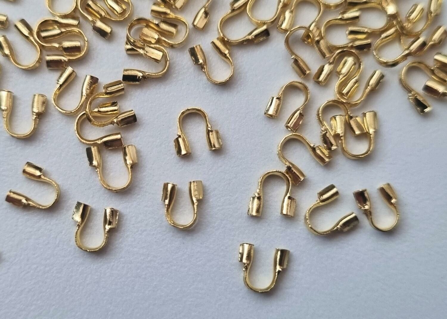 50 st guldfärgade Wire guards, smyckestillbehör