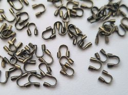 50 st bronsfärgade Wire guards, smyckestillbehör
