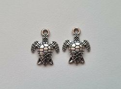 2 st sköldpaddor. Berlocker / charms / hängen