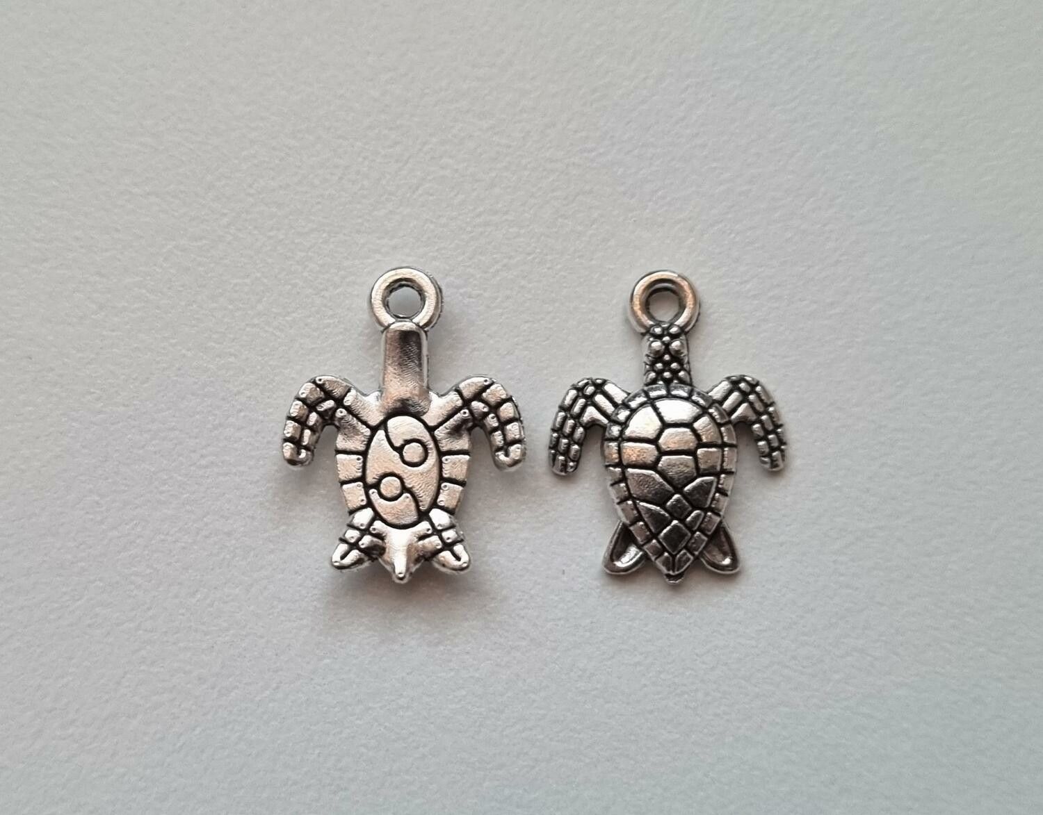 2 st sköldpaddor. Berlocker / charms / hängen