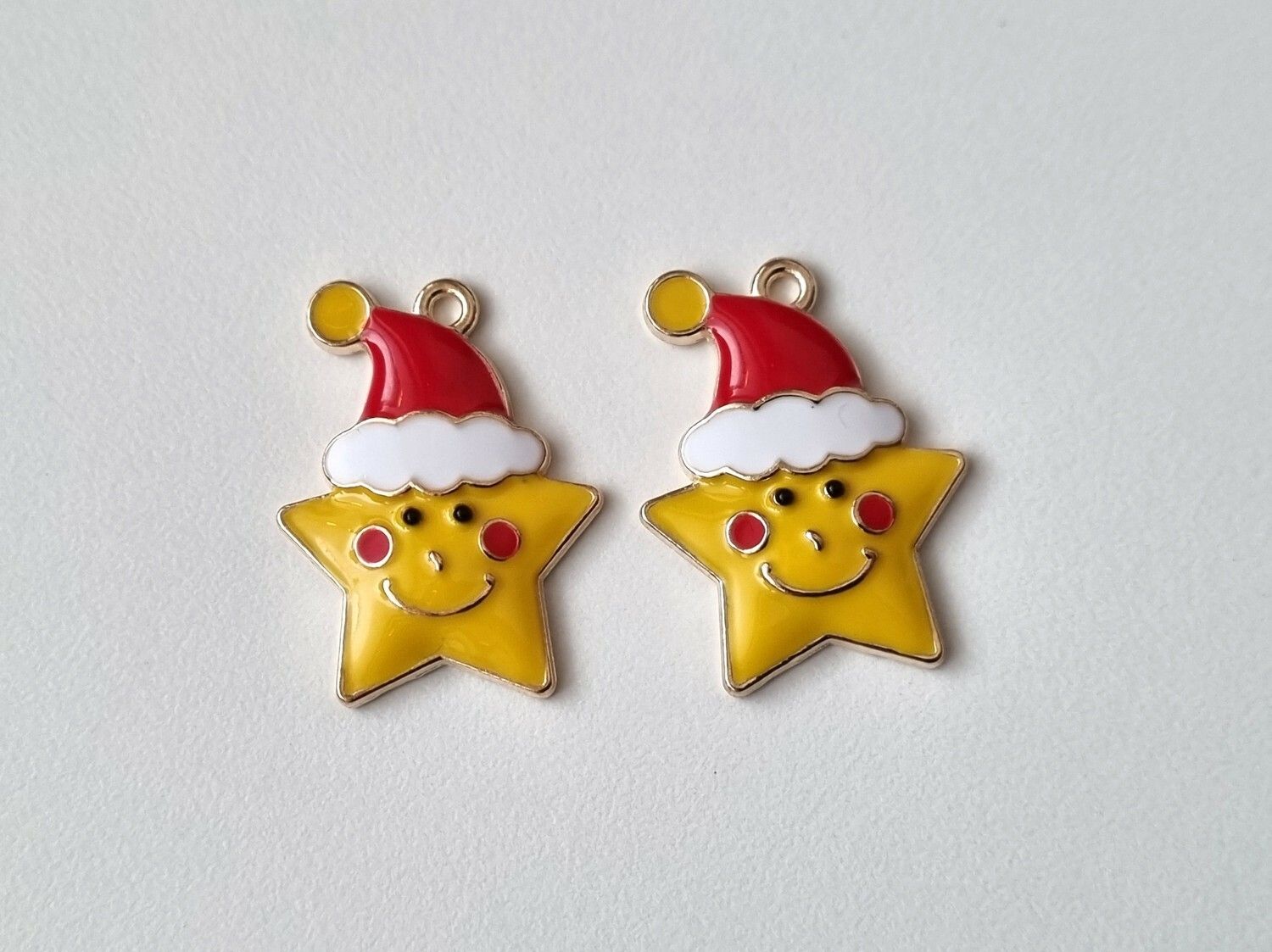 2 st glada julstjärnor med tomtehatt