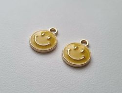2 st gula smileys. Berlocker / charms för smyckestillverkning