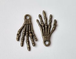 2 st bronsfärgade händer / skeletthänder