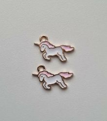 2 st rosa enhörningar - berlocker / charms / hängen