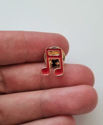 Pins, röd liten not / musiknot
