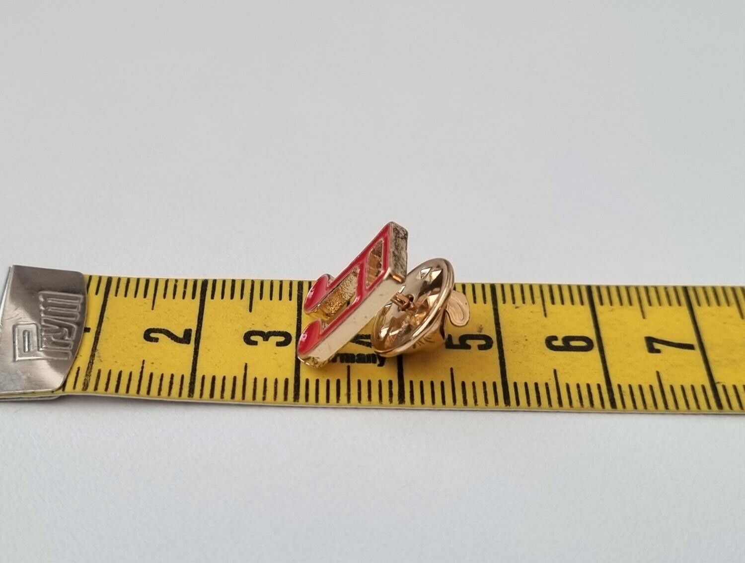 Pins, röd liten not / musiknot