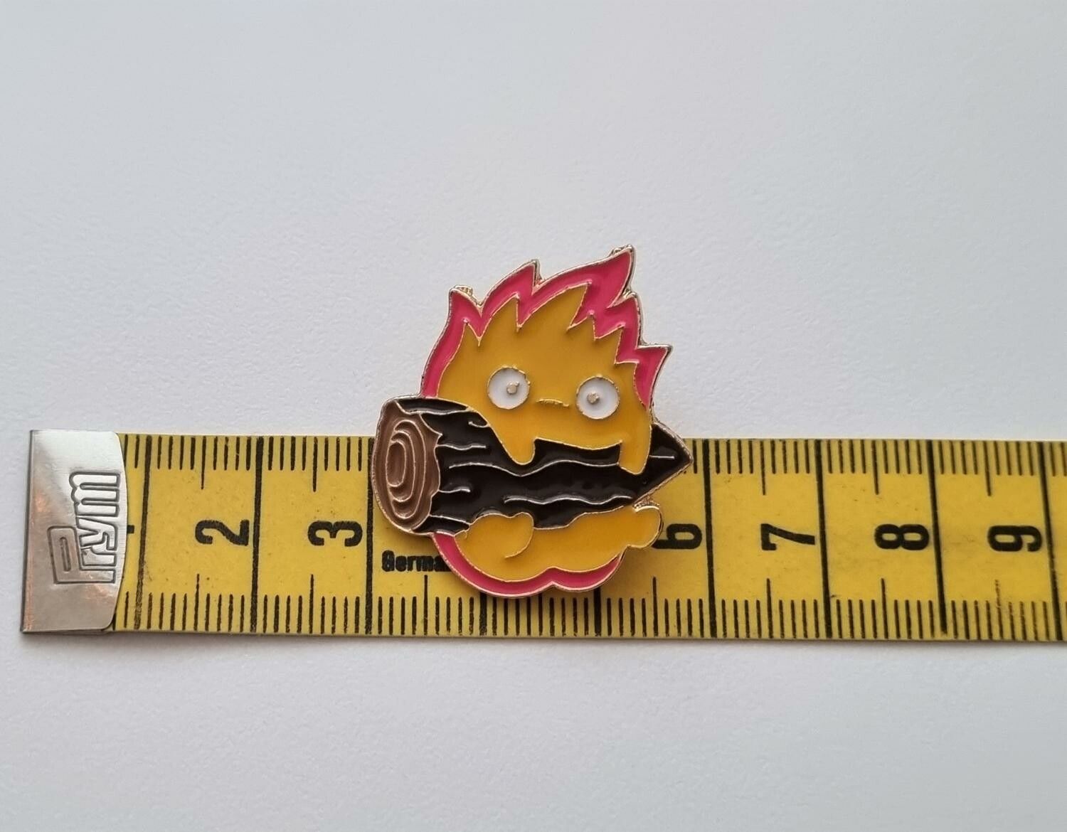 Pins, Elddemon över en stubbe