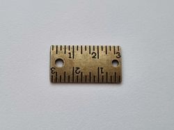 1 st bronsfärgad linjal / minilinjal. Berlock / charm / miniatyr