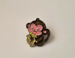 Pin, gullig liten apa med en klase bananer