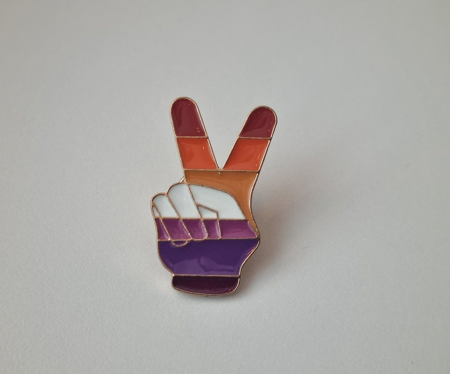 Pin med peace-tecken
