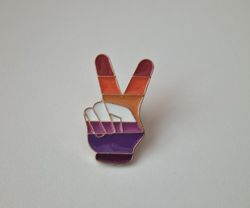 Pin med peace-tecken
