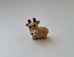 Gullig liten brun ko / kossa, miniatyr