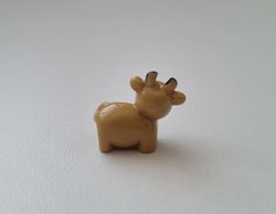 Gullig liten brun ko / kossa, miniatyr