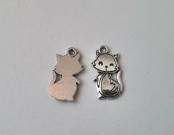 2 st silverfärgade katter. Berlocker Charms