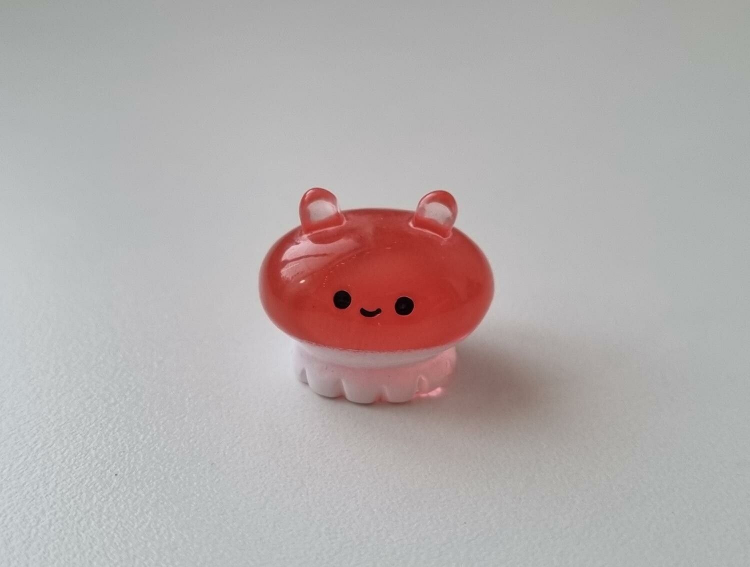 Röd liten sagofigur, miniatyr