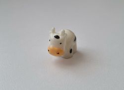 Gullig liten prickig ko / kossa, miniatyr