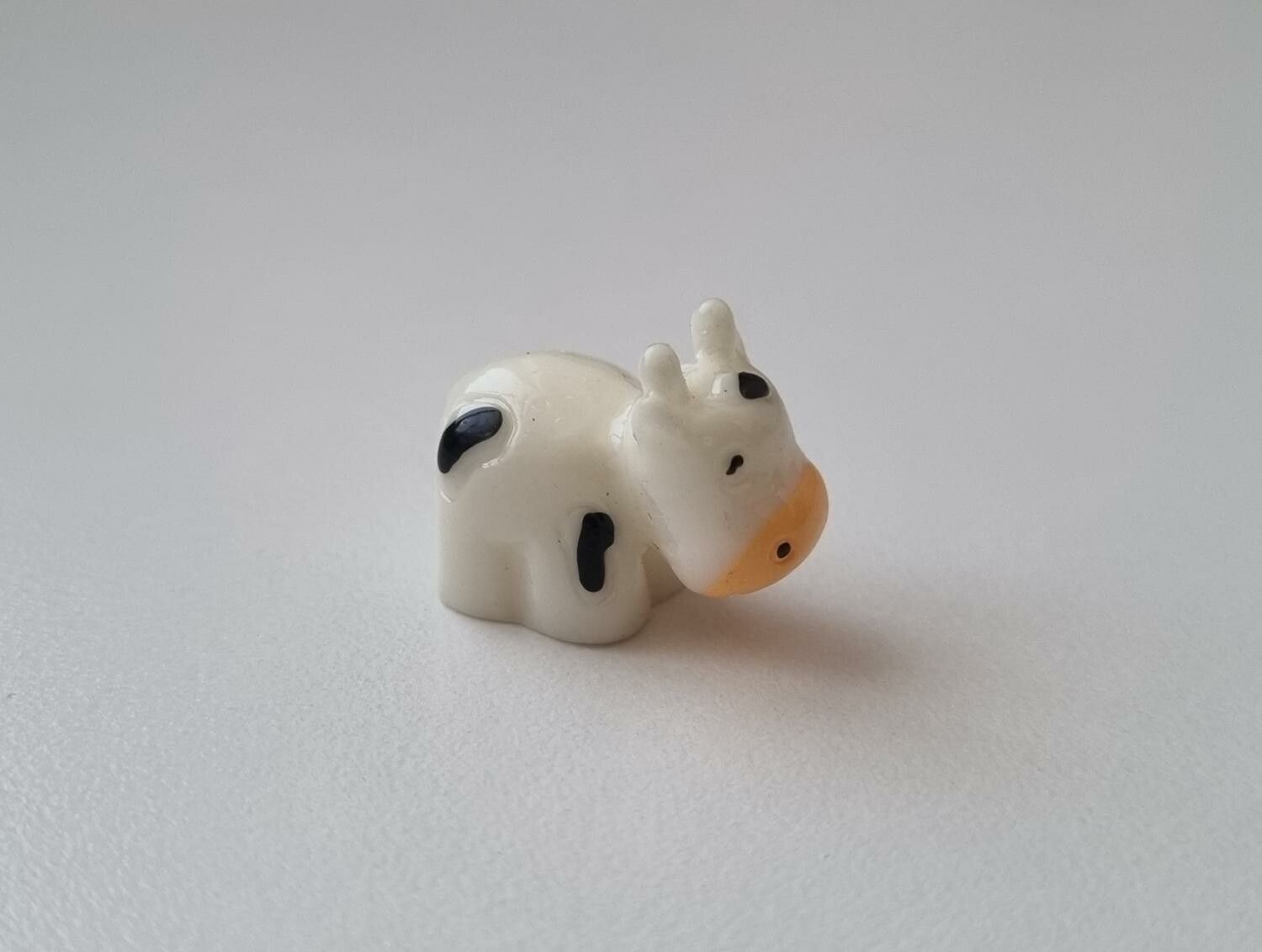 Gullig liten prickig ko / kossa, miniatyr