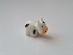 Gullig liten prickig ko / kossa, miniatyr