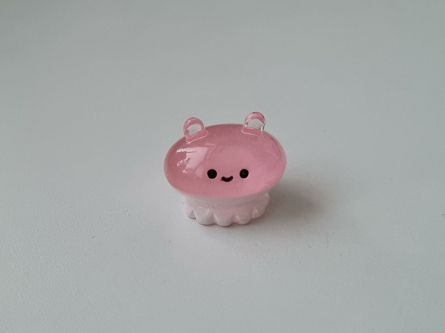 Gullig liten rosa sagofigur, miniatyr
