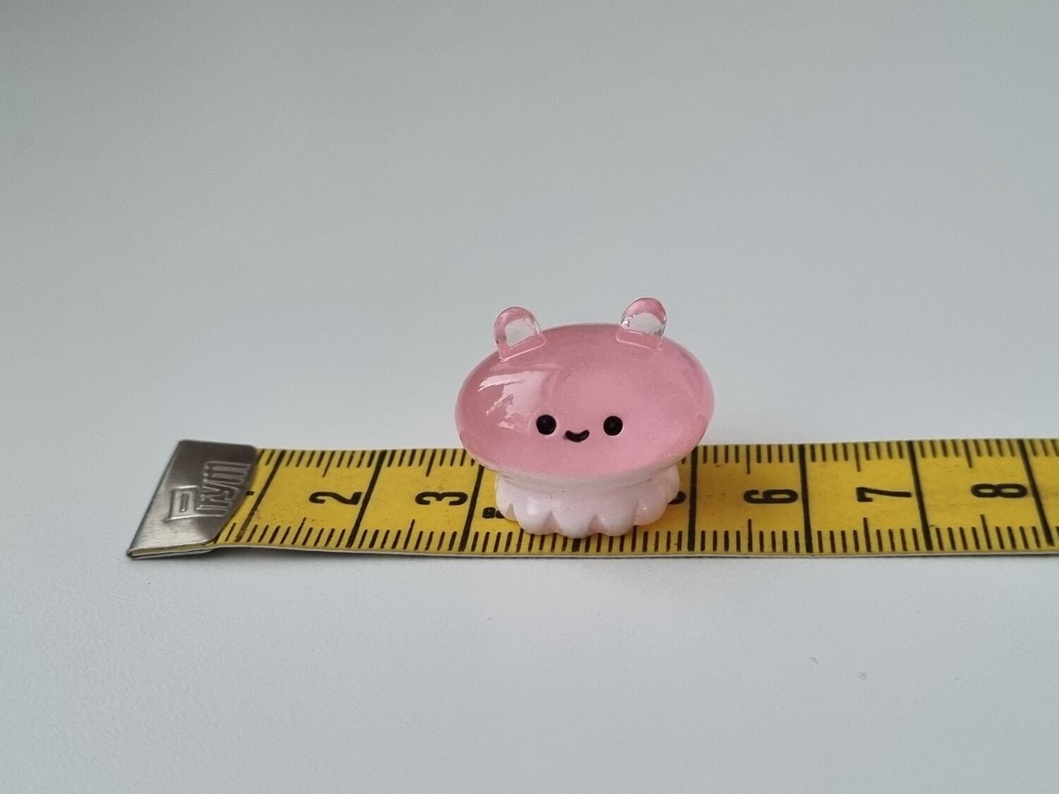 Gullig liten rosa sagofigur, miniatyr