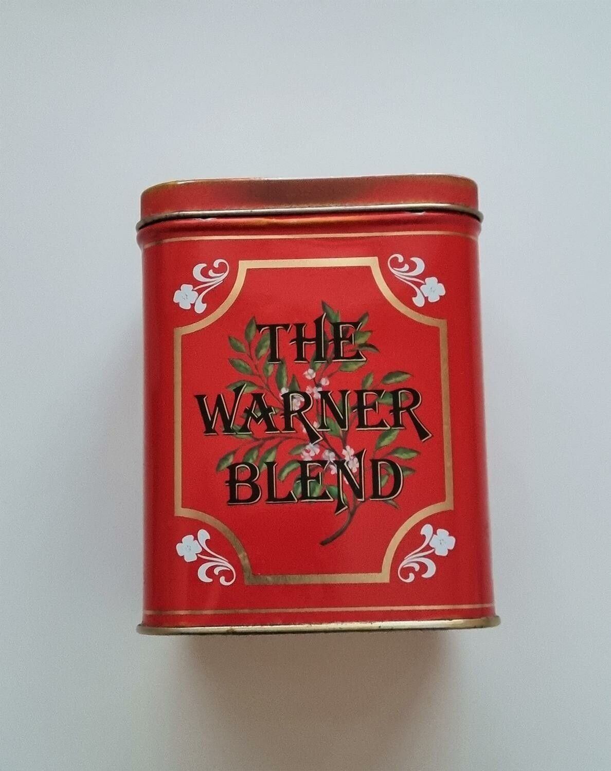 Röd kaffe- / teburk i plåt. The warner blend