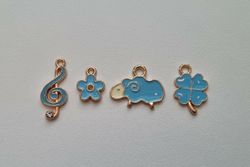 4 st blå Berlocker Charms (får, fyrklöver, blomma och not)