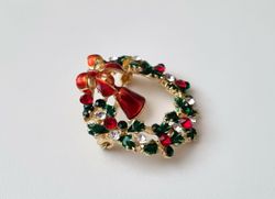 Brosch julkrans. Julkransbrosch med bjällra