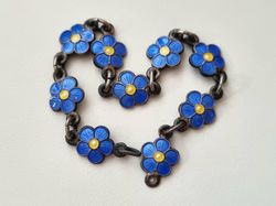 Armband, små blå/gula blommor