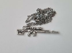 Halsband med gevär