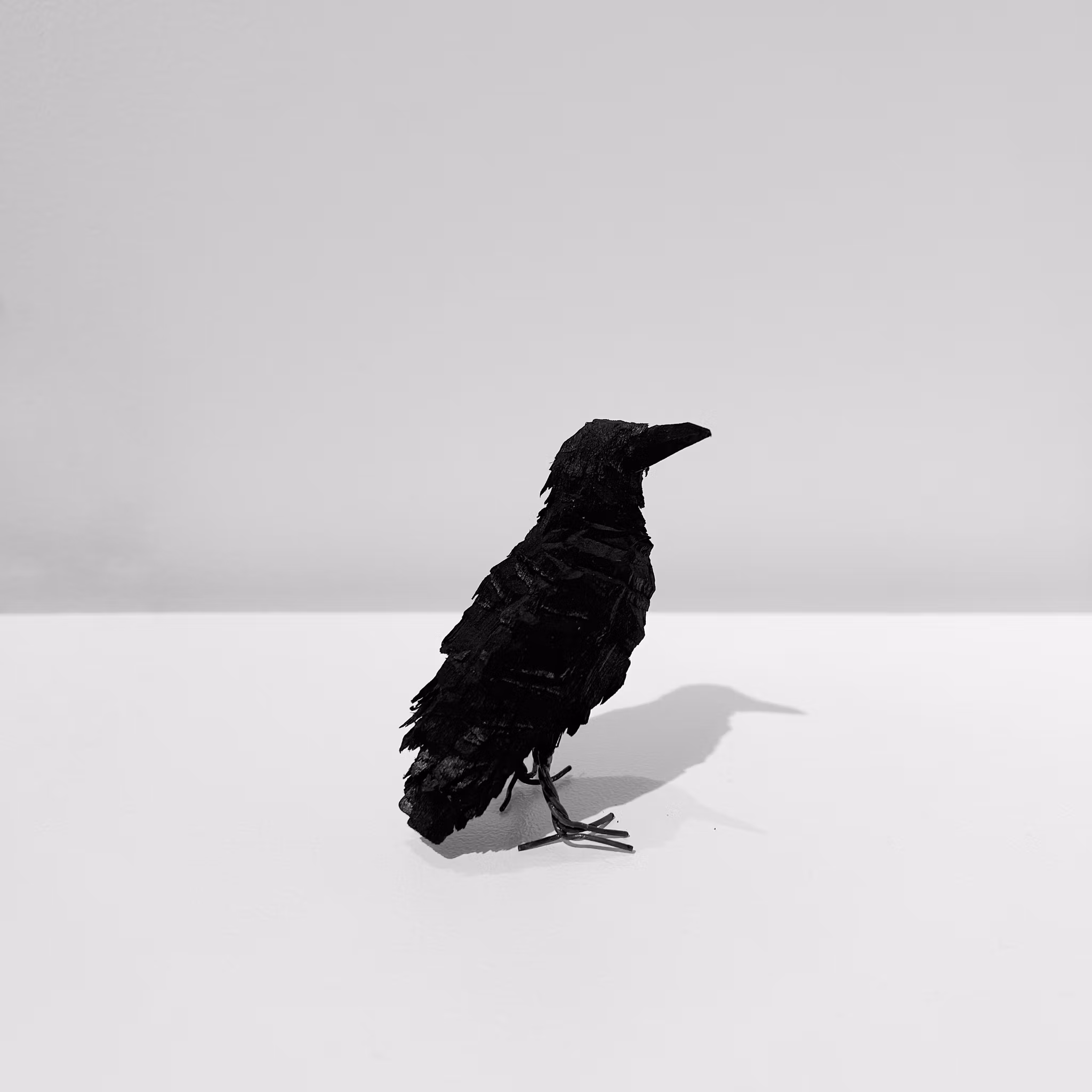 Liten Korp i svart trä