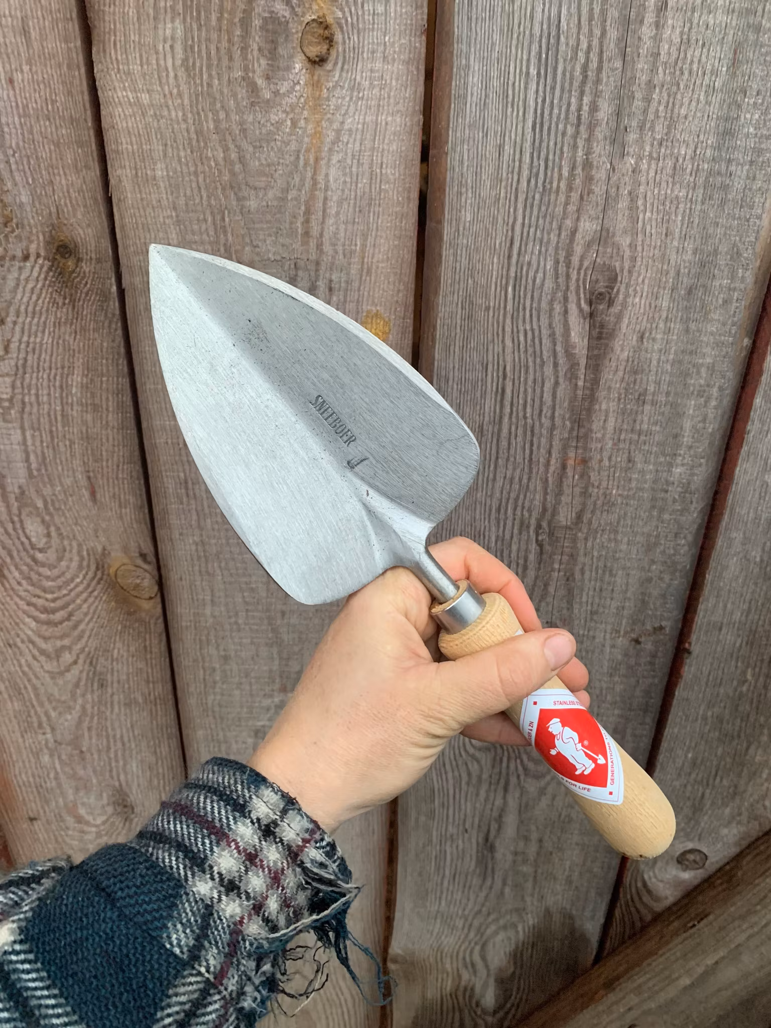 Planteringsspade som håller, Sneeboer