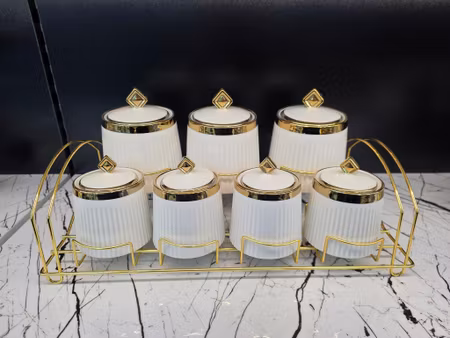 Sett med 7 porselen krukker - Gull