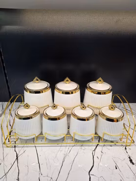 Sett med 7 porselen krukker - Gull