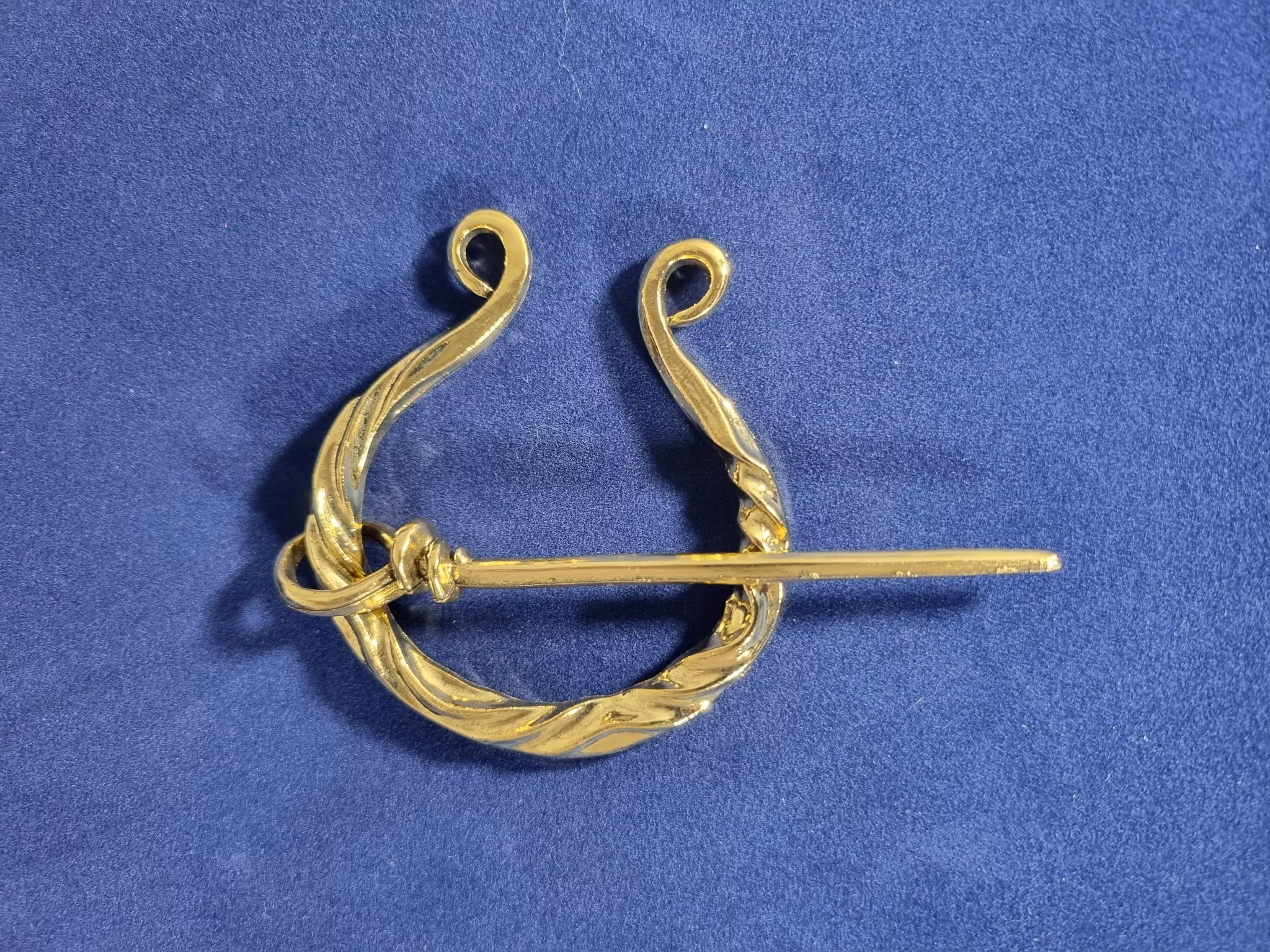 Mantelspänne 5