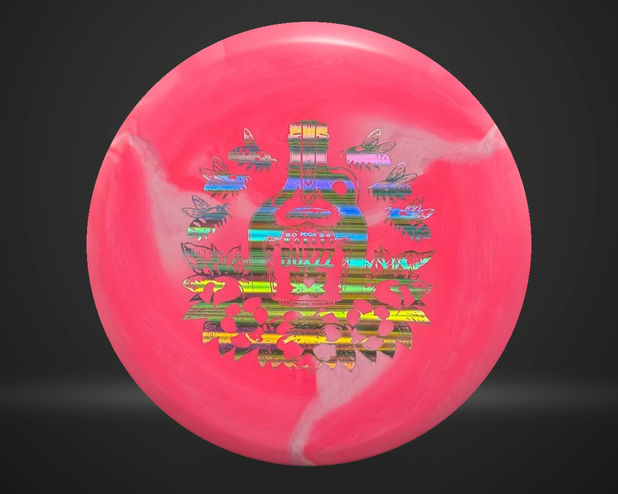 ESP Swirl Buzzz 2024 PDGA Worlds midrange i rosa, vist forfra på mørk produktbakgrunn