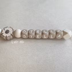 Pacifier holder with the name FLOWER Cream /Taupe