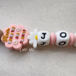 Pacifier holder with name BLOOM Som Pink / WHITE (max 5 letters can fit on this design)