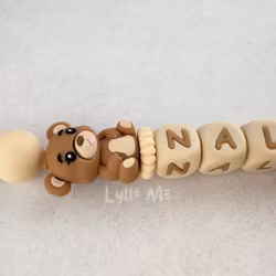 Pacifier holder with name NALLE Milkchocolate/WHEAT
