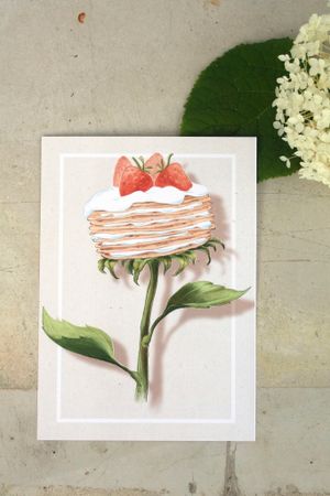 Pannkakssolros tårta, humoristiskt vykort