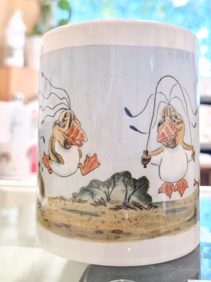 Melonpingviner som leker, motiv på en mugg