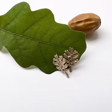 Örhängen Tiny Oak Leaf - Brons/Guld