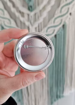 Hekledame, button